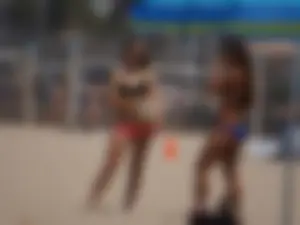Beach volleyball babe with a nice ass in pink bikini bottom