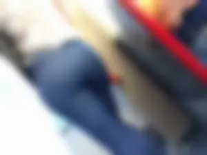 Train girl in tight jeans with a nice ass standing around