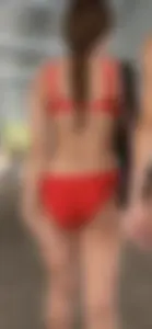 Beauty picks at her bikini wedgie