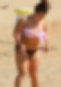 Thick girl on the beach with big boobs and a big booty