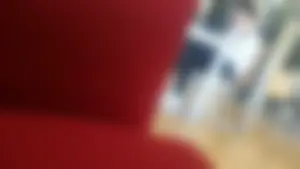 Hot Teen in Sports Trousers Sitting at the Library With Crossed Legs