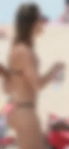 Girl in peach bikini on the beach with a great body and great ass