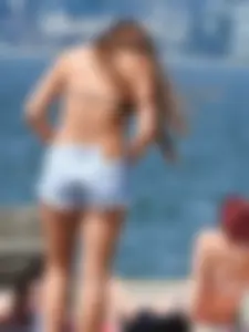 Stripping down to her bikini [016]