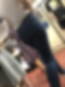 Candid girl wearing tight blue jeans and sandals on high platforms