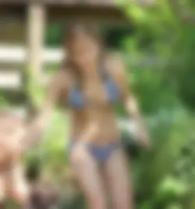 Sexy girl at the pool in a bikini with great tits