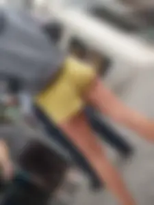 Skinny ass eating her yellow shorts