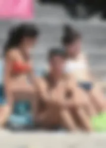 Bunch of sexy babes at the beach in bikinis