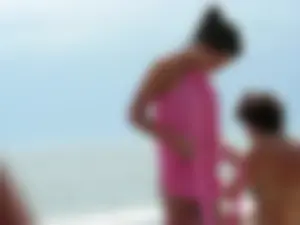 Perfect bodied beach girl topless and in thong bikini