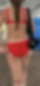 Beauty picks at her bikini wedgie