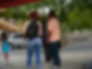 Red haired lady with a nice ass in tight jeans waiting for the bus