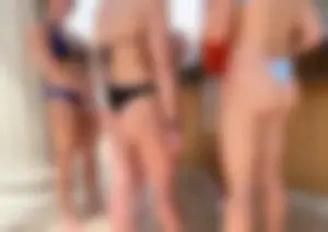 Hot babes in bikinis by pool