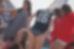 A group of teens in bikinis on the beach