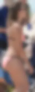 Girl in peach bikini on the beach with a great body and great ass