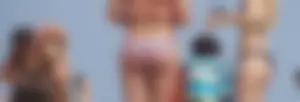Two thick white girls in bikinis on the beach with big asses