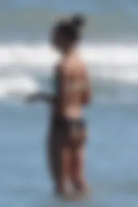 Beach girl out in a bikini with a nice round big booty