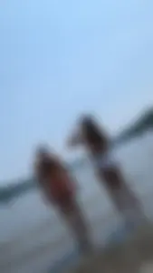 Two beautiful Girls in red and White bikini on the beach. oc