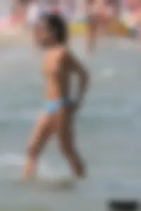 A bunch of sexy beach voyeur babes in bikinis, thongs and topless