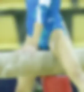 Skinny Teen Athlete Sitting on Pommel Horse