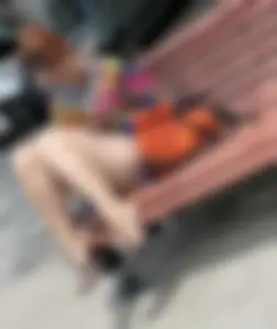 Mature Redhead in a Dress Flashing Panties While Sitting on a Street Bench