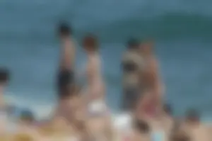 Topless girls on a beach in Barcelona