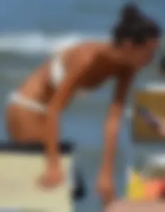 Hot girl at the beach with a nice ass in a white bikini