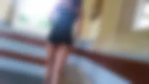 Hot brunette showing her ass cheeks in tiny shorts