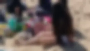 Beautiful Teen with Miniskirt resting on the beach