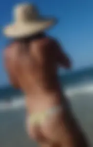 Cute girl on the beach with a decent body in thong bikini