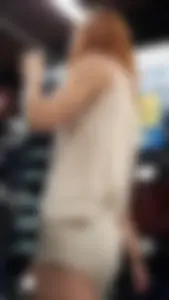 Redhead hottie in shorts shopping with a nice ass