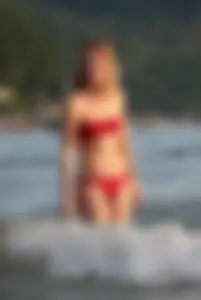 Skinny blonde babe in red bikini with camel toe and little pokies