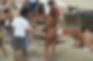 Topless girls on a beach in Barcelona