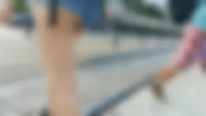 Girl walking in denim shorts showing some of her ass cheeks