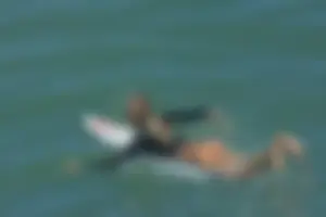 Candid surfers in bikinis
