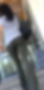 Brunette in yoga flare going up escalator