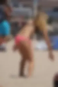 Beach volleyball babe with a nice ass in pink bikini bottom