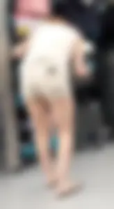Redhead hottie in shorts shopping with a nice ass