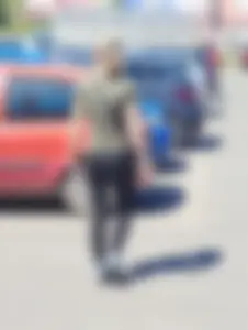 Skinny blonde milf at parking lot