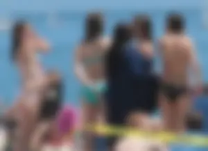 Bunch of sexy babes at the beach in bikinis