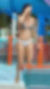 Sexy brunette lady with nice tits at the pool in a semi thong bikini