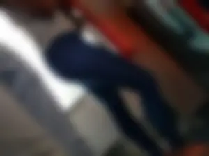 Train girl in tight jeans with a nice ass standing around