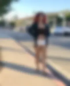 Big boobed redhead walking with no shoes and in shorts
