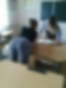 College Girl in Tight Jeans Bending Over Desk in Classroom Creepshot