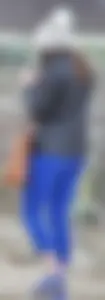 Cute girl with a nice ass in tight blue leggings along the water in San Fran