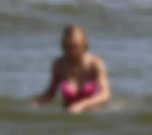 Two sexy beach teens in bikinis, one thick and one skinny with big boobs