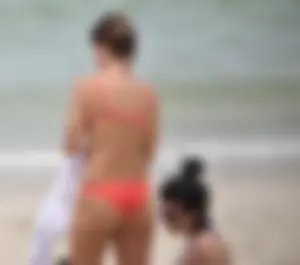 Two sexy ass girls on the beach in bikinis