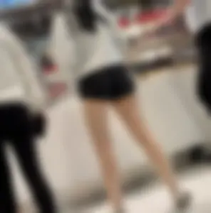 Asian girl in tight black shorts at the mall