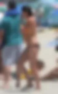 Bunch of sexy babes at the beach in bikinis