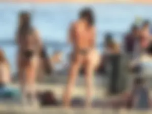 Fit girl with nice body in thong bikini on the beach