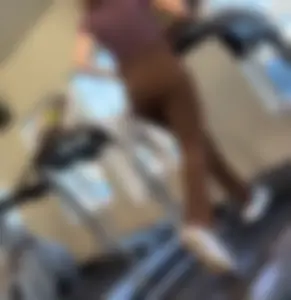 Brown Lululemon flares running on treadmill