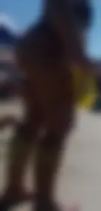 Fat ass milf at the beach in a thong bikini